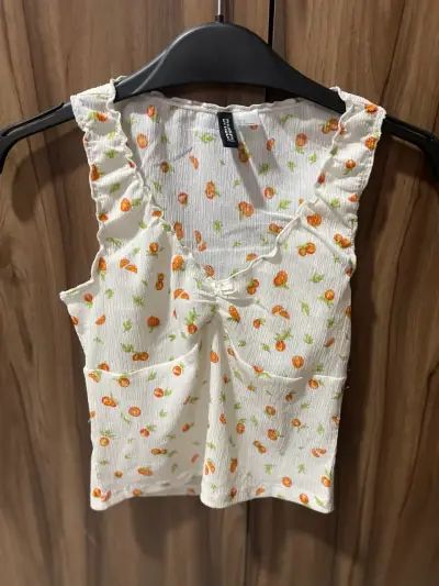 Top sin mangas con estampado de frutas H&M - miniatura 1