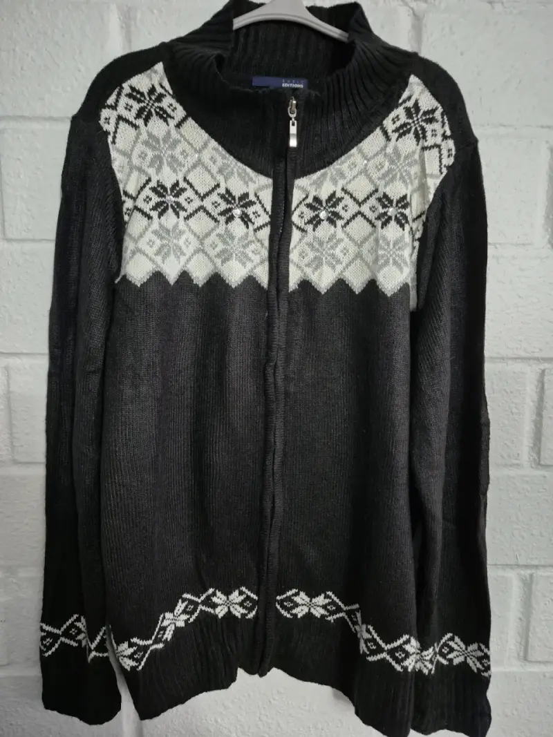 Chaleco negro con diseño de copos de nieve