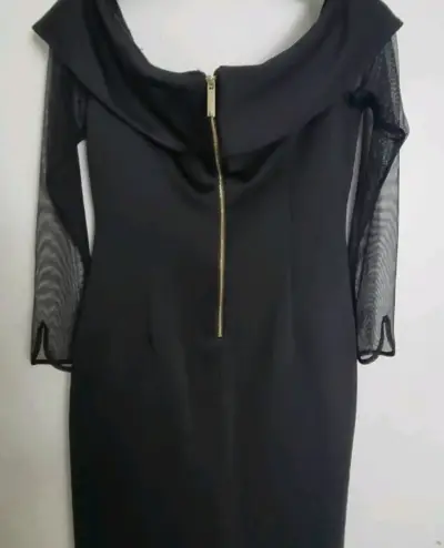 Vestido negro elegante con mangas transparentes - miniatura 3