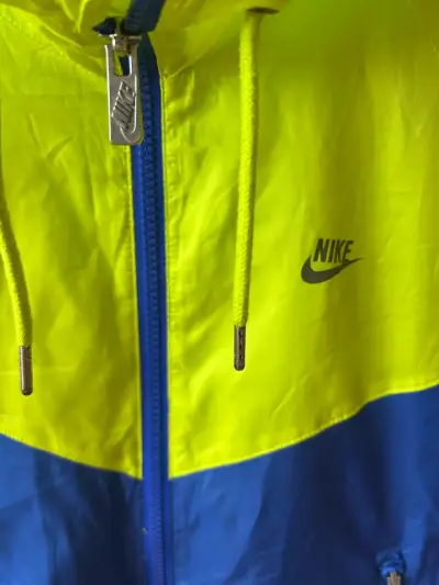 Chaqueta cortaviento Nike azul y amarillo - miniatura 2