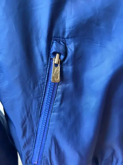 Chaqueta cortaviento Nike azul y amarillo - miniatura 3