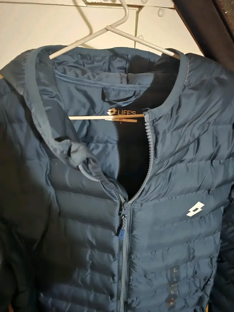 Chaqueta acolchada azul con capucha Lotto