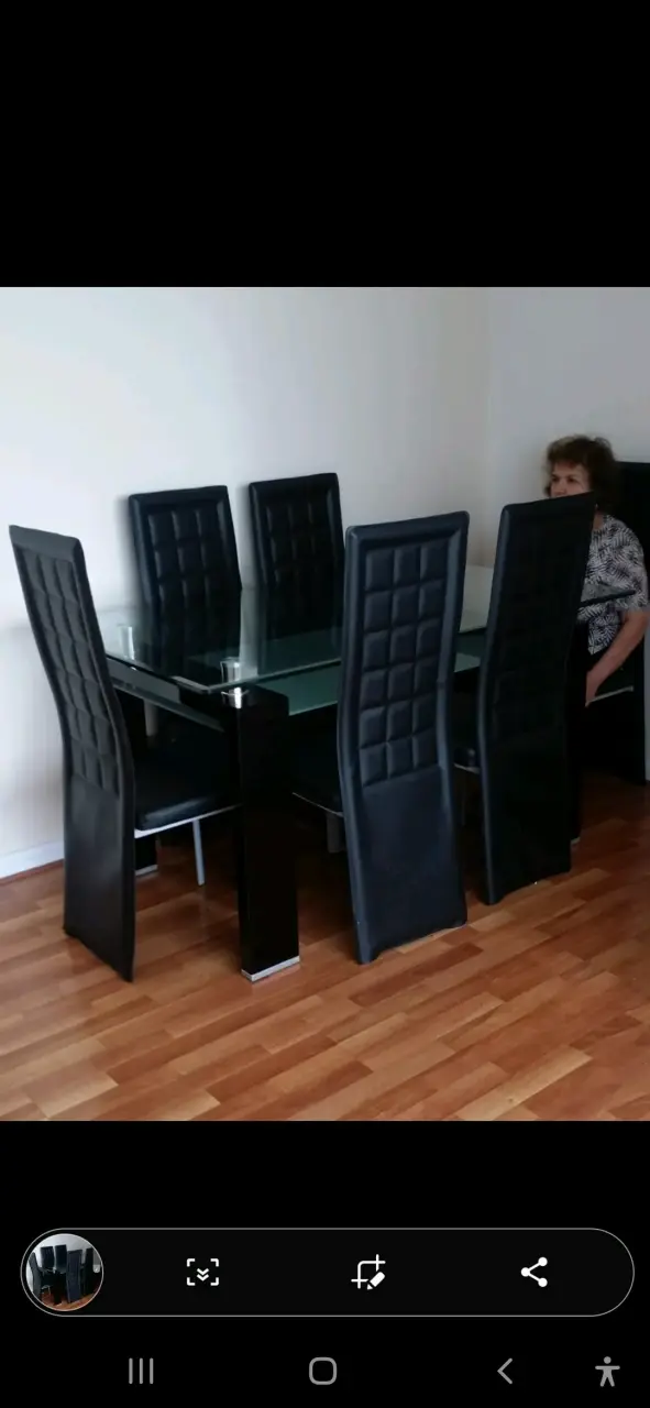 Juego de comedor de vidrio con sillas negras