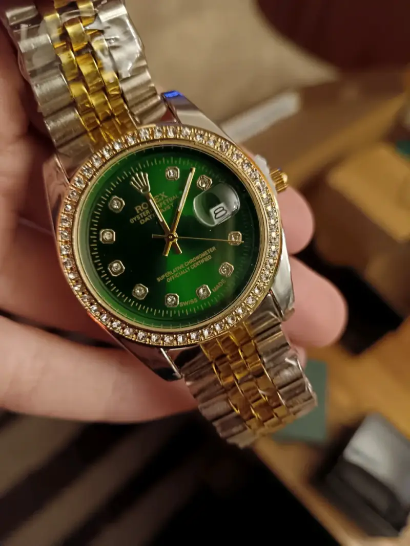 Reloj Rolex Oyster Perpetual verde y dorado