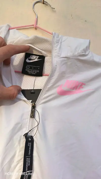 Chaqueta deportiva Nike blanca y rosada - miniatura 1