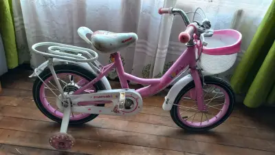 Bicicleta infantil rosa con ruedas de entrenamient - miniatura 1