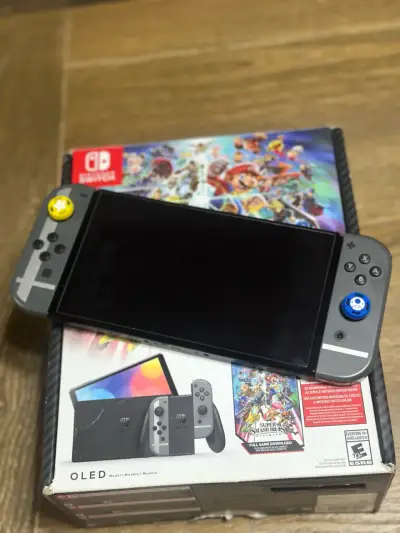 Nintendo Switch OLED con Super Smash Bros y Zelda - miniatura 1