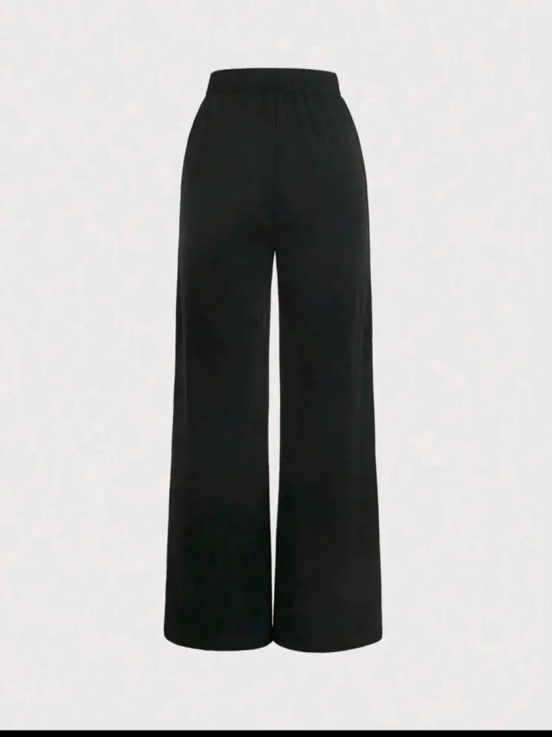 Pantalones negros con detalle de lazo blanco - 2