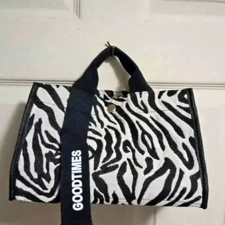 Bolso de mano estampado cebra con correa ajustable - 1