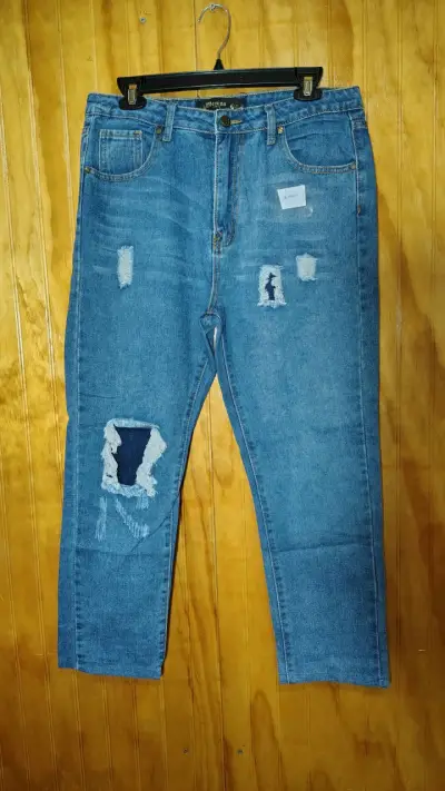 Jeans de mezclilla desgastados para mujer - miniatura 1