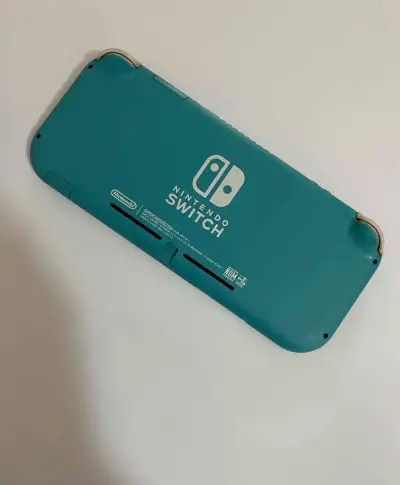 Nintendo Switch Lite turquesa en buen estado - miniatura 2