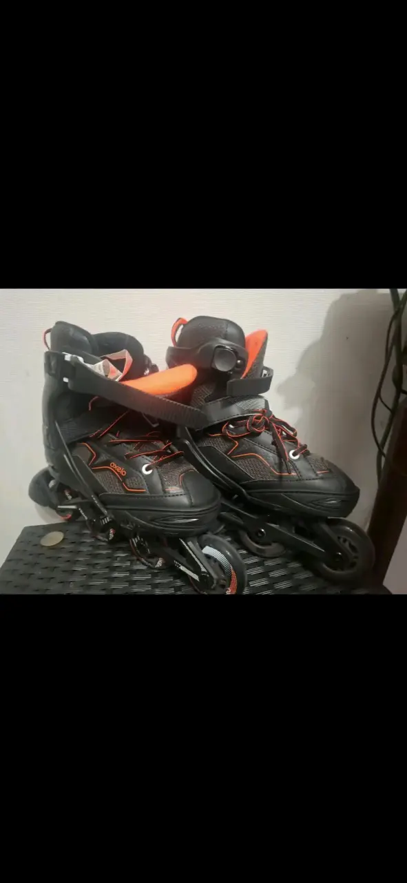 Patines en línea Oxelo negros y naranjas