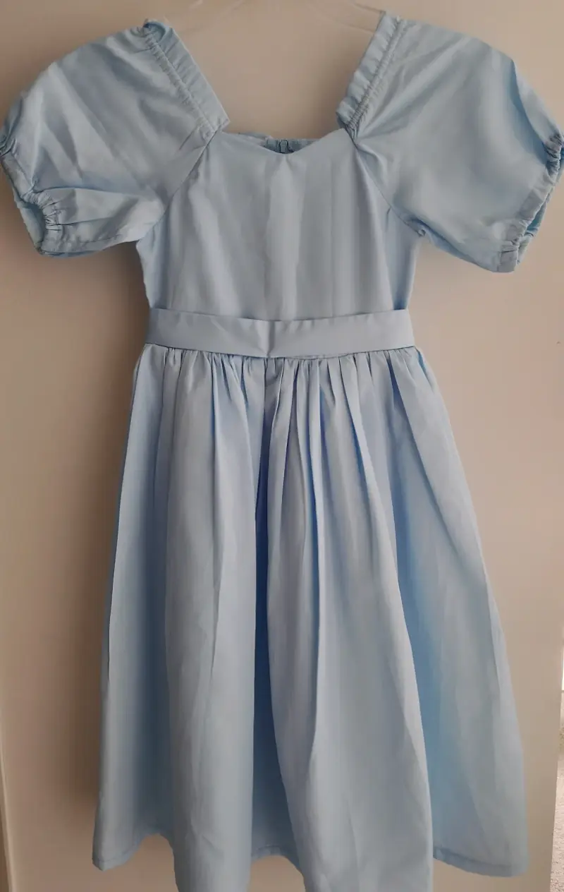 Vestido azul claro con lazos para niña - 1
