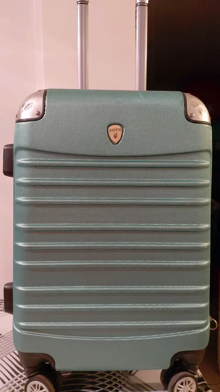 Maleta rígida verde con ruedas giratorias