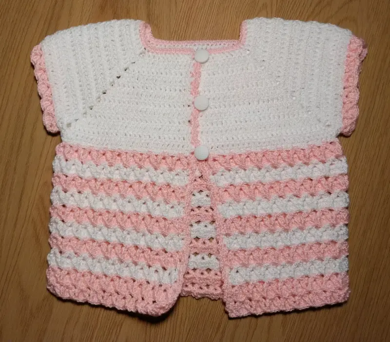 Chaleco tejido a crochet para bebé en rosa y blanc