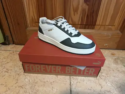 Zapatillas deportivas blancas y negras Puma - miniatura 1