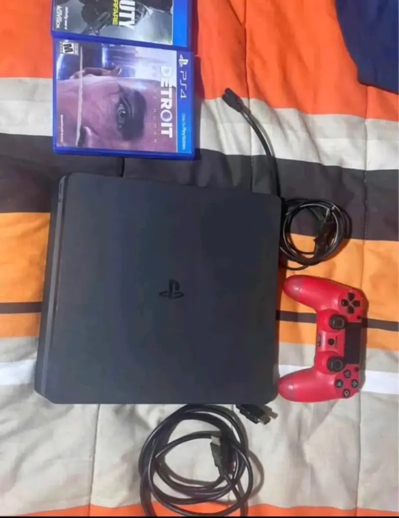 Consola PS4 con control rojo y juegos incluidos - 2