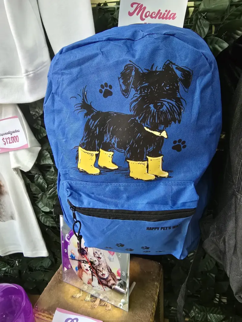 Mochila azul con diseño de perro y botas amarillas - 1