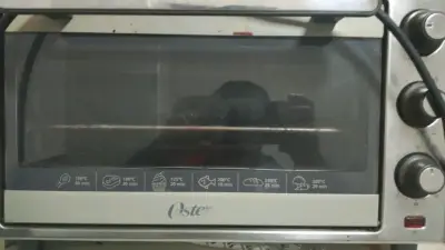 Horno eléctrico Oster con controles manuales - miniatura 1