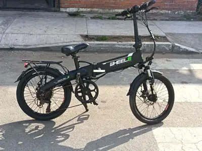 Bicicleta eléctrica plegable Wheele en buen estado - miniatura 1