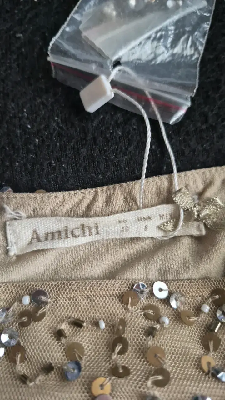Falda corta dorada con lentejuelas Amichi - 2