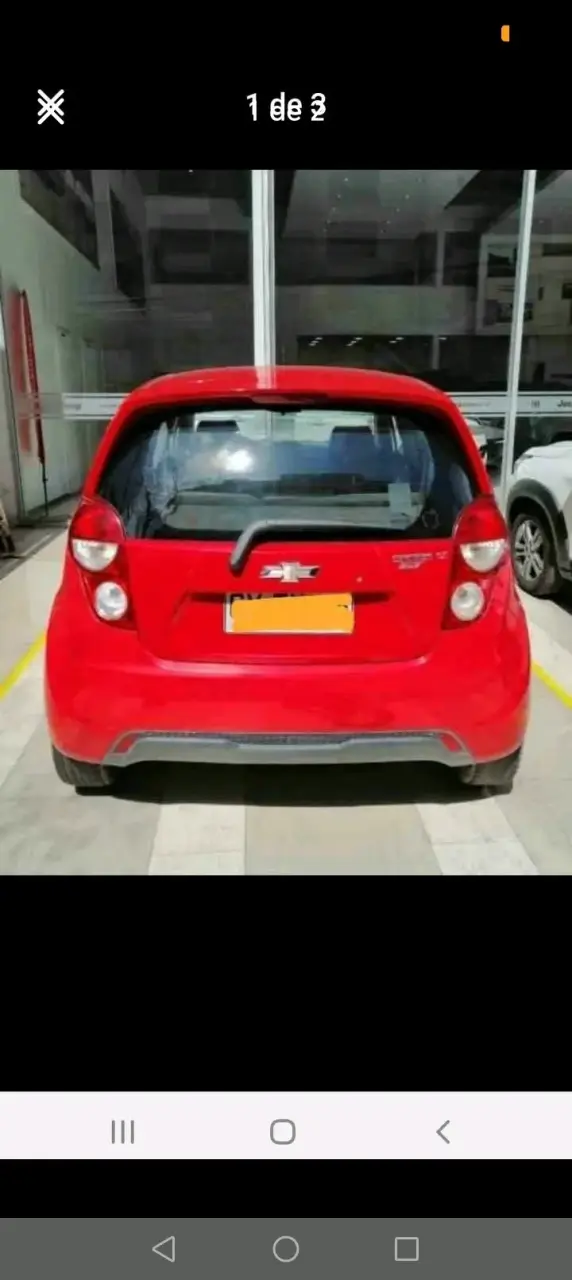 Auto Chevrolet Spark GT rojo en buen estado - 1