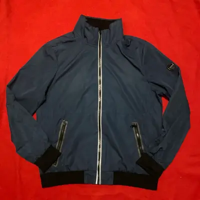 Chaqueta azul Calvin Klein con cierre reflectante - miniatura 1