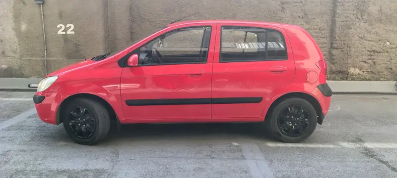 Hyundai Getz 2011, 124.900 km, rojo en buen estado - 3