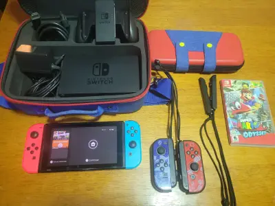 Nintendo Switch con accesorios y juego Super Mario Odyssey - miniatura 1