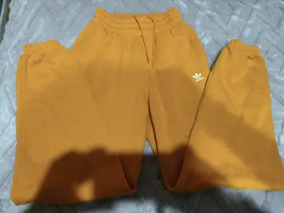 Pantalones deportivos naranjas Adidas para hombre - miniatura 1