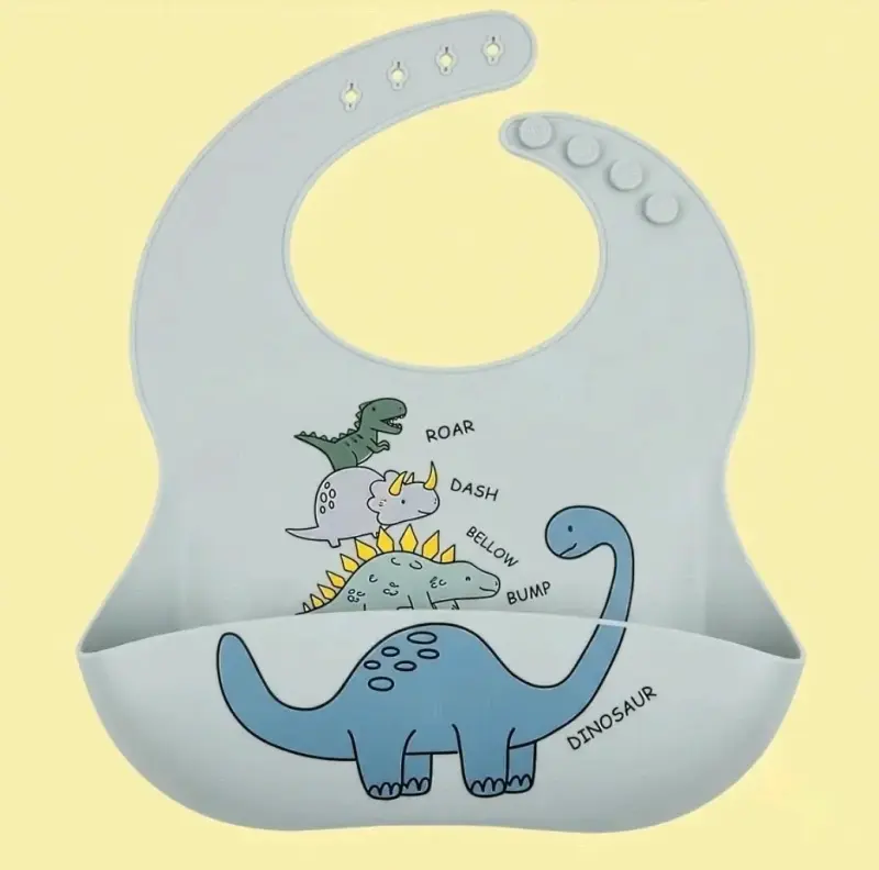 Babero de silicona para bebé con diseño de dinosaurios