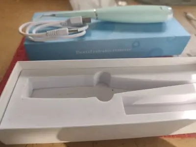 Removedor de sarro dental eléctrico portátil - miniatura 1