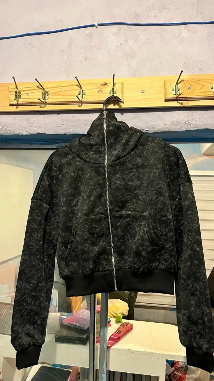 Polerón con capucha negro jaspeado unisex