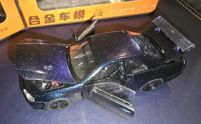 Auto juguete  Nissan Skyline GTR R34 1:32 - miniatura 3