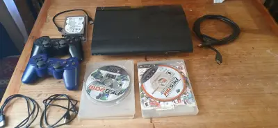 Consola PS3 con juegos y accesorios - miniatura 1