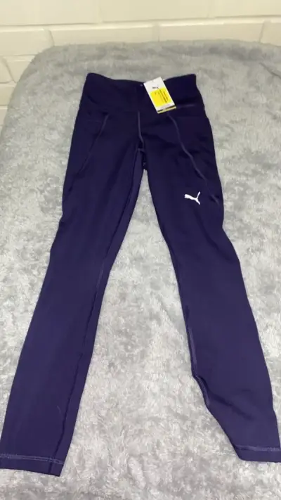 Leggings deportivos morados Puma para mujer - miniatura 1