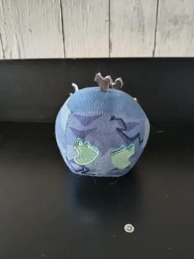 Mini fruta de  peluche azul con diseño de dragón - miniatura 1