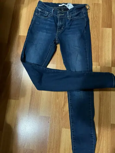 Jeans ajustados azul oscuro para mujer - miniatura 1