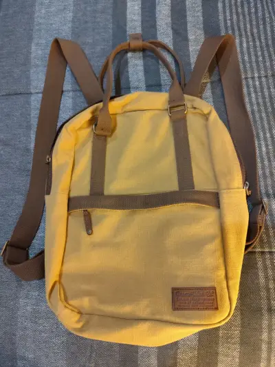 Mochila amarilla de lona con correas ajustables - miniatura 1
