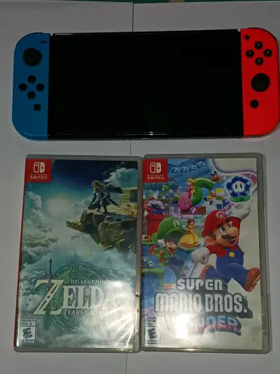 Consola Nintendo Switch OLED con juegos Zelda y Mario - miniatura 1