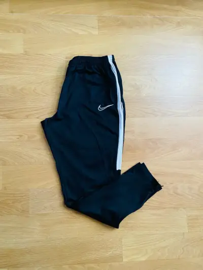 Pantalones deportivos Nike negros con franjas - miniatura 1