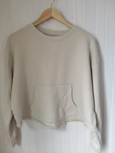 Polerón beige con bolsillo delantero - miniatura 1