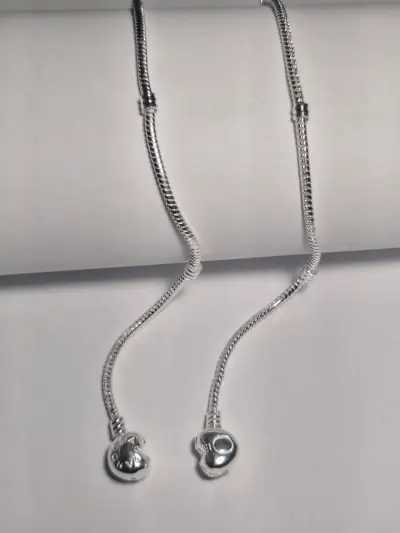 Pulsera de plata con dijes variados - miniatura 2