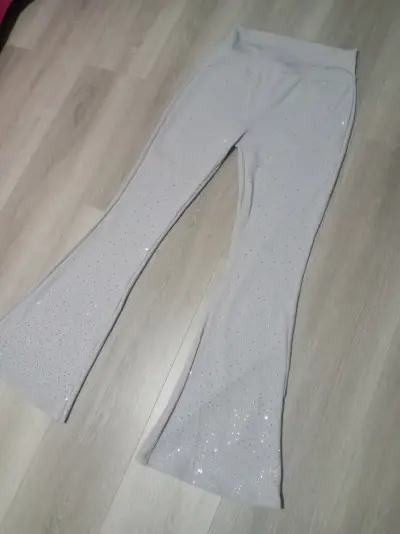 Pantalones acampanados con brillo para mujer - miniatura 1