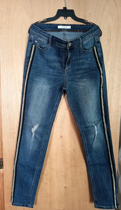 Jeans de mujer con rayas laterales desgastados - miniatura 1