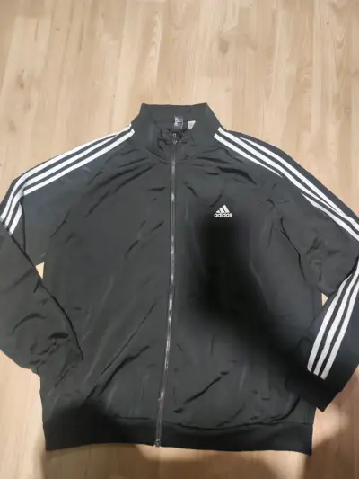 Chaqueta deportiva negra Adidas con franjas blancas - miniatura 1