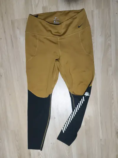 Leggings deportivos Nike Dri-Fit marrón y negro - miniatura 1
