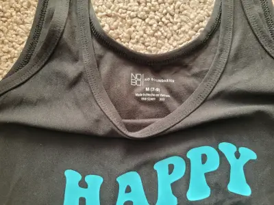 Polera niña sin mangas negra con estampado - miniatura 2