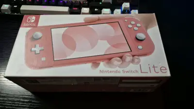 Nintendo Switch Lite coral Chipeada - miniatura 2