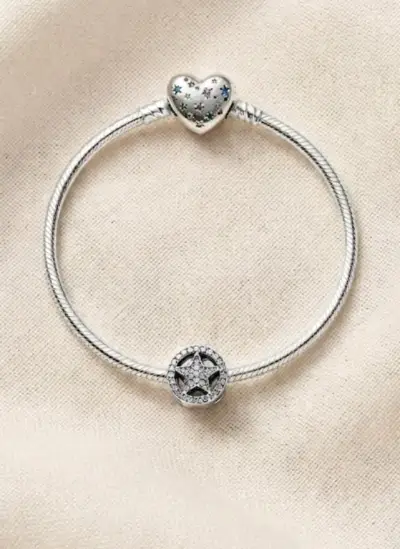 Pulsera de plata con dije de corazón y estrella - miniatura 1